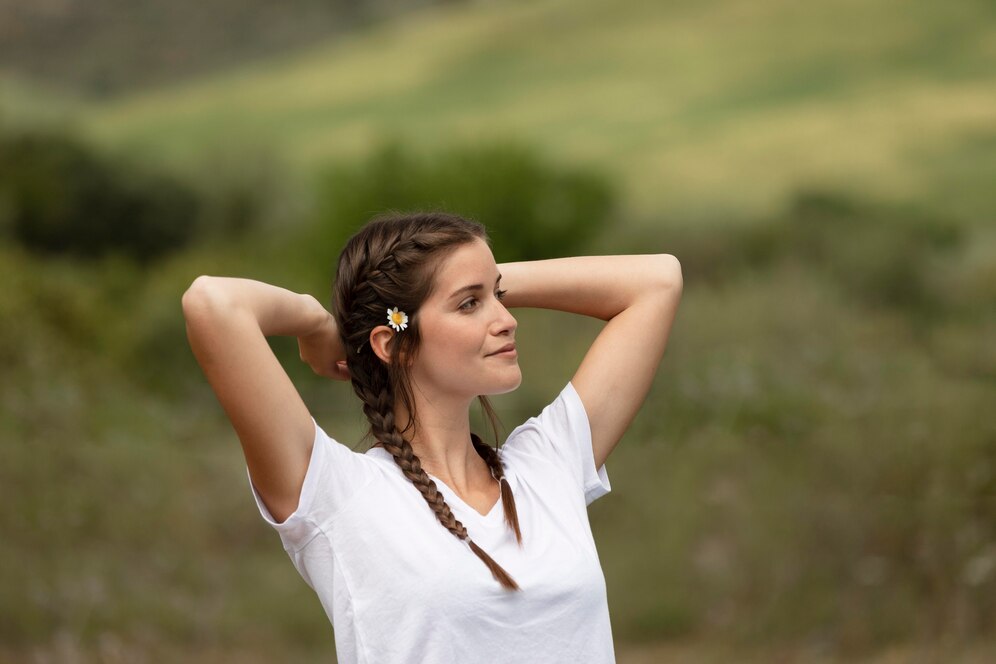 A serene individual meditating outdoors to relieve stress quickly