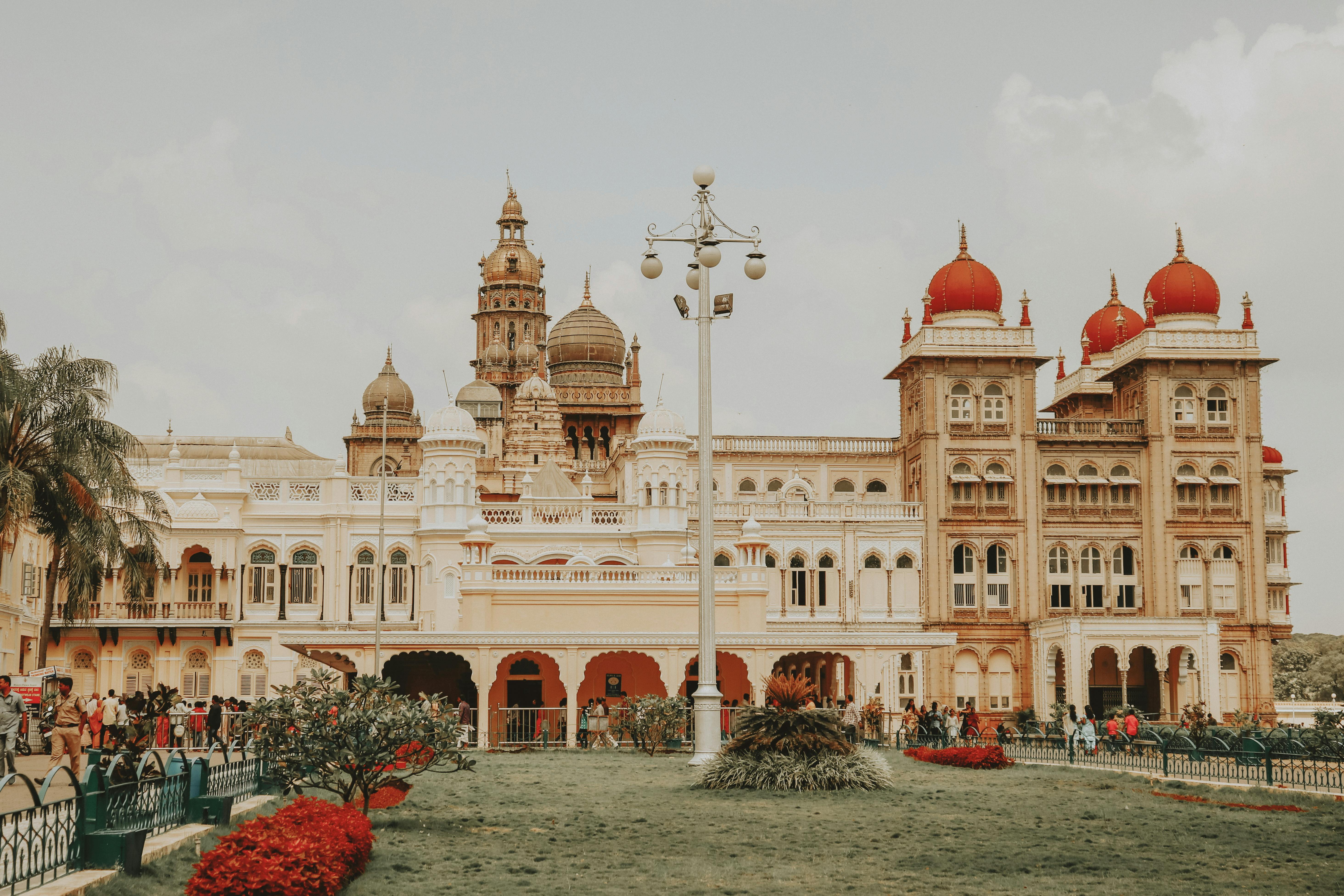 A panoramic view of Mysore Palace illuminated during Dussehra.